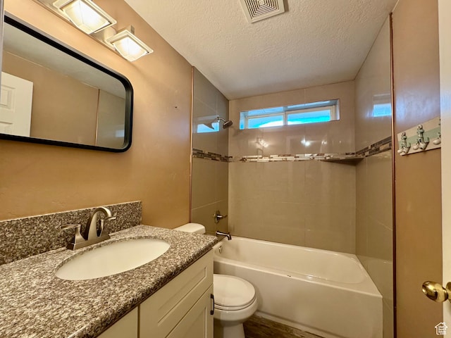 781 N Sherwood Dr, Layton, UT 84041 - full bathroom with visible vents, toilet, a textured ceiling, vanity, and shower / tub combination