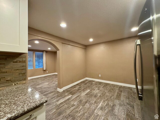 781 N Sherwood Dr, Layton, UT 84041 - interior space featuring dark wood-type flooring, arched walkways, baseboards, and recessed lighting
