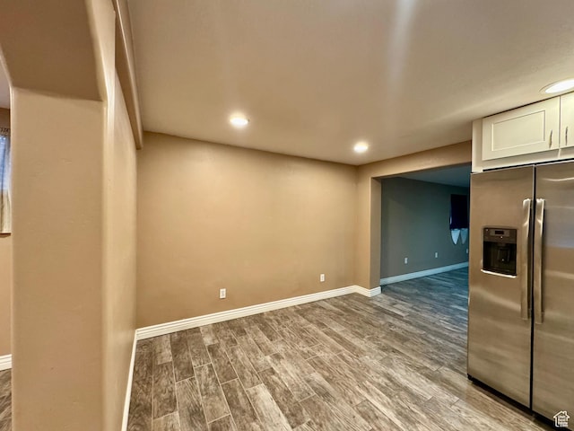 781 N Sherwood Dr, Layton, UT 84041 - kitchen with stainless steel fridge with ice dispenser, white cabinetry, recessed lighting, wood finished floors, and baseboards