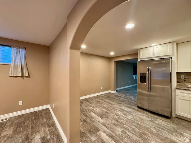 781 N Sherwood Dr, Layton, UT 84041 - kitchen with stainless steel fridge with ice dispenser, light wood-style floors, white cabinetry, and baseboards