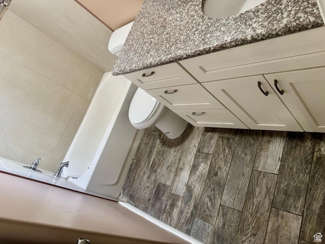 781 N Sherwood Dr, Layton, UT 84041 - bathroom featuring a bathing tub, toilet, and vanity