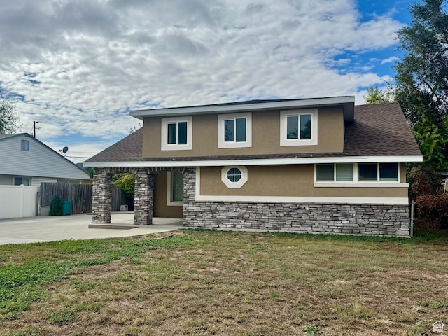 781 N Sherwood Dr, Layton, UT 84041 - view of front facade featuring a front yard, a patio, stucco siding, and fence