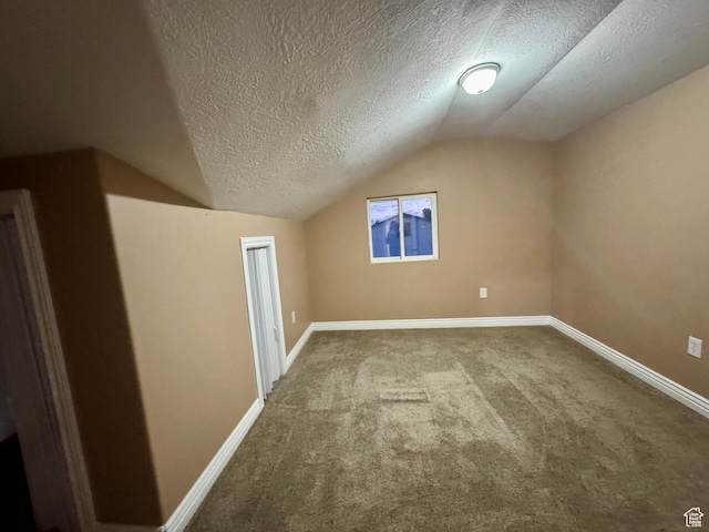 781 N Sherwood Dr, Layton, UT 84041 - bonus room featuring carpet floors, a textured ceiling, baseboards, and lofted ceiling