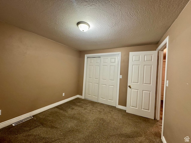 781 N Sherwood Dr, Layton, UT 84041 - unfurnished bedroom with dark carpet, visible vents, baseboards, and a closet