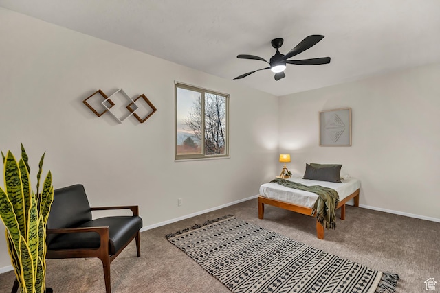 carpeted bedroom featuring baseboards and ceiling fan