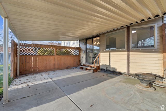 view of patio featuring entry steps and fence