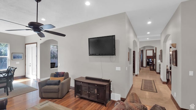 2847 W Amini Way S, Jordan, UT 84095 - living room featuring visible vents, baseboards, arched walkways, a ceiling fan, and recessed lighting