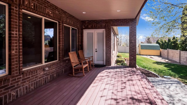 2847 W Amini Way S, Jordan, UT 84095 - wooden terrace with an outbuilding, a fenced backyard, and a yard