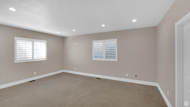 2847 W Amini Way S, Jordan, UT 84095 - carpeted spare room featuring baseboards, visible vents, and recessed lighting