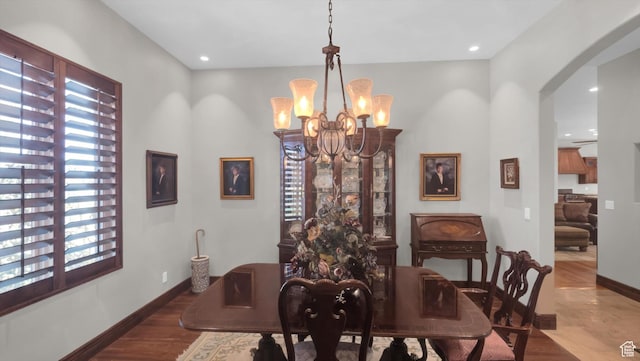 2847 W Amini Way S, Jordan, UT 84095 - dining area with arched walkways, recessed lighting, wood finished floors, a notable chandelier, and baseboards