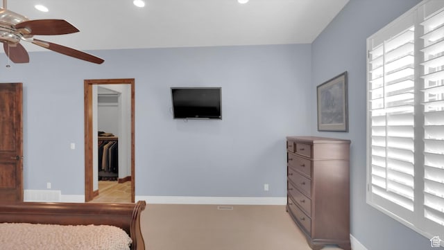 2847 W Amini Way S, Jordan, UT 84095 - bedroom featuring a walk in closet, multiple windows, and baseboards