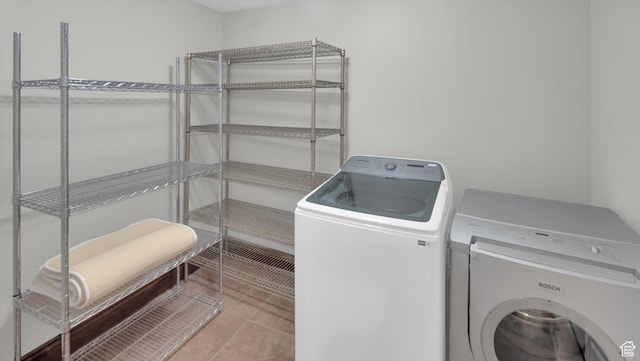 2847 W Amini Way S, Jordan, UT 84095 - clothes washing area featuring tile patterned flooring, washing machine and dryer, and laundry area