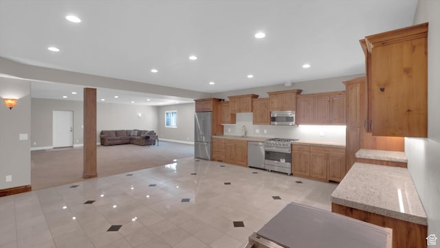 2847 W Amini Way S, Jordan, UT 84095 - kitchen with recessed lighting, appliances with stainless steel finishes, light tile patterned flooring, open floor plan, and baseboards