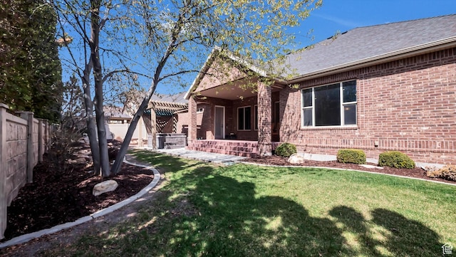 2847 W Amini Way S, Jordan, UT 84095 - exterior space with a front yard, a fenced backyard, and brick siding