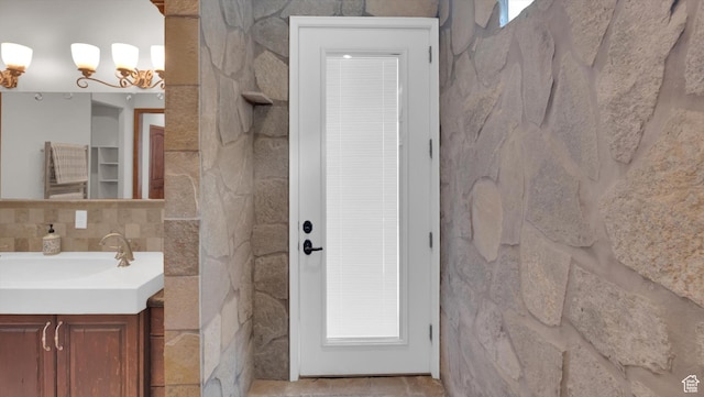 2847 W Amini Way S, Jordan, UT 84095 - bathroom featuring backsplash, an inviting chandelier, and vanity