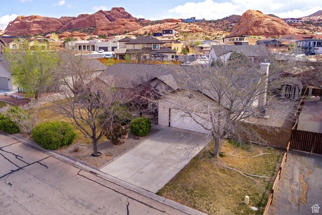 drone / aerial view with a mountain view and a residential view
