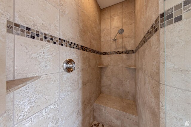 full bathroom with a tile shower