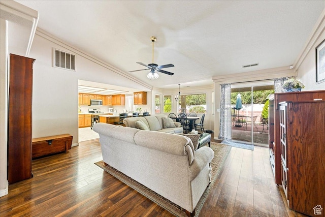 living area with visible vents, dark wood-style flooring, and ceiling fan