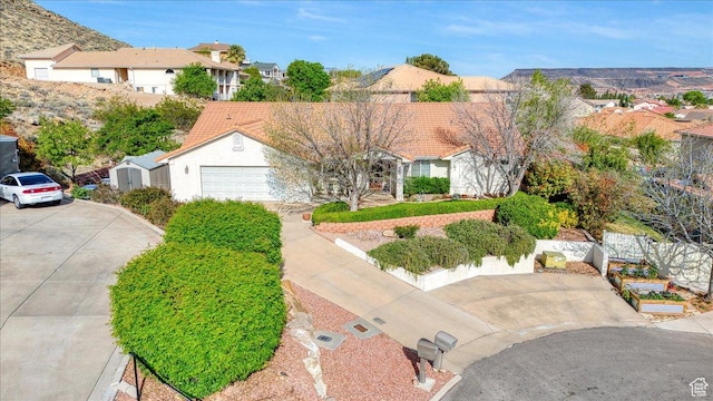 view of front of home featuring a residential view and driveway