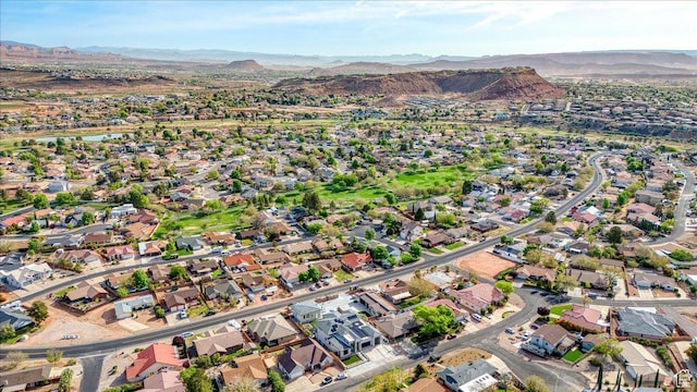 birds eye view of property with a mountain view and a residential view