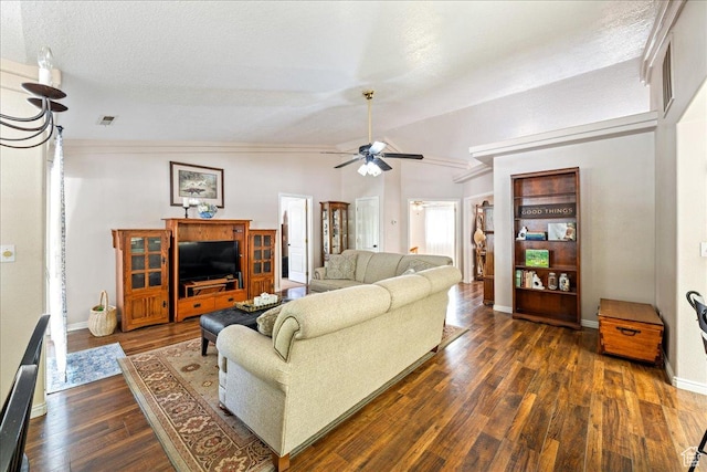 living area featuring a ceiling fan, visible vents, dark wood-style flooring, lofted ceiling, and baseboards