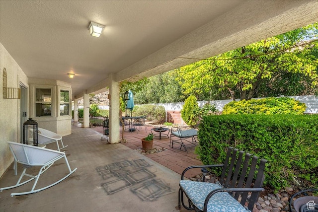 view of patio featuring fence