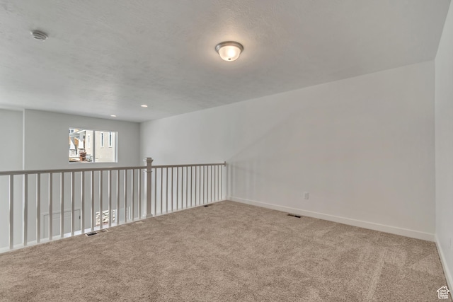 6864 S Static Peak Dr Unit 258, West Jordan, UT 84081 - carpeted empty room featuring a textured ceiling, baseboards, and visible vents