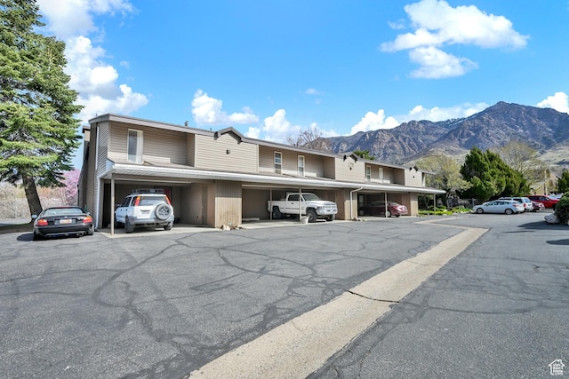 1298 Lorl Ln Unit 2, Ogden, UT 84404 - partially covered parking lot featuring a mountain view