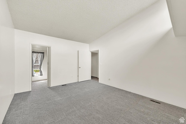 1298 Lorl Ln Unit 2, Ogden, UT 84404 - spare room featuring visible vents, carpet flooring, and a textured ceiling
