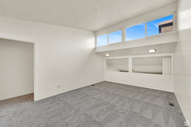 1298 Lorl Ln Unit 2, Ogden, UT 84404 - carpeted empty room with a textured ceiling and visible vents