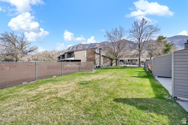 1298 Lorl Ln Unit 2, Ogden, UT 84404 - view of yard featuring a mountain view and fence