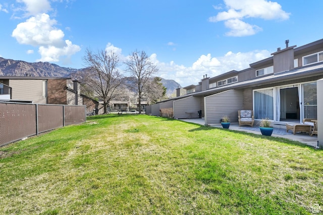 1298 Lorl Ln Unit 2, Ogden, UT 84404 - view of yard with a patio, a mountain view, and fence