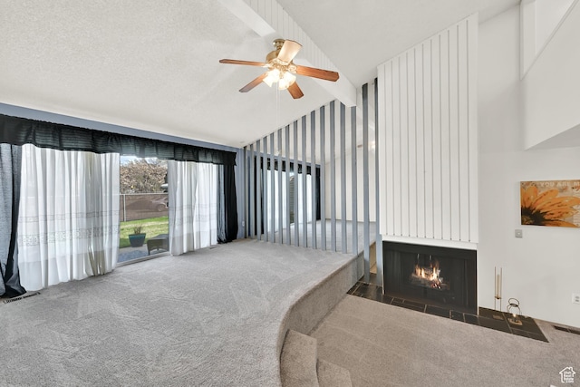 1298 Lorl Ln Unit 2, Ogden, UT 84404 - carpeted living area featuring visible vents, ceiling fan, a textured ceiling, a fireplace, and high vaulted ceiling