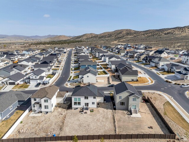 2888 E Carriage Hill Dr, Eagle Mountain, UT 84005 - drone / aerial view with a mountain view and a residential view