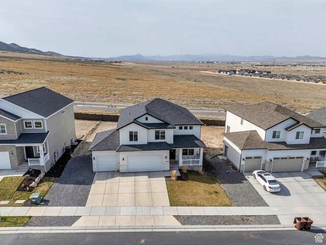 2888 E Carriage Hill Dr, Eagle Mountain, UT 84005 - drone / aerial view featuring a rural view and a mountain view