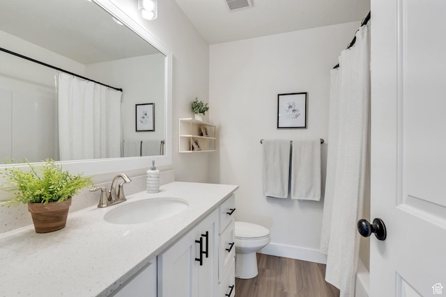 2888 E Carriage Hill Dr, Eagle Mountain, UT 84005 - full bath featuring vanity, visible vents, toilet, wood finished floors, and baseboards