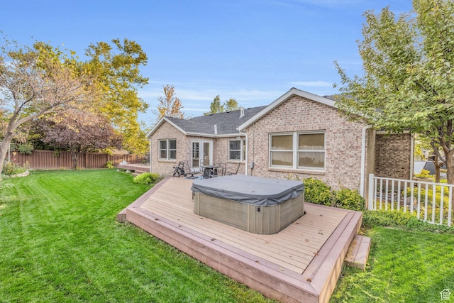 307 E 680 N, Lindon, UT 84042 - rear view of house featuring a covered hot tub, a wooden deck, a lawn, fence, and brick siding