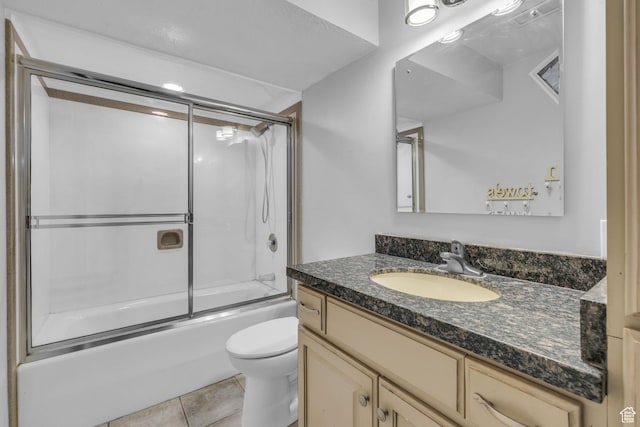 307 E 680 N, Lindon, UT 84042 - bathroom featuring combined bath / shower with glass door, toilet, vanity, and tile patterned floors