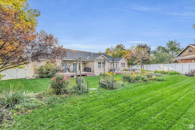 307 E 680 N, Lindon, UT 84042 - view of yard featuring a deck, a fenced backyard, and a gate