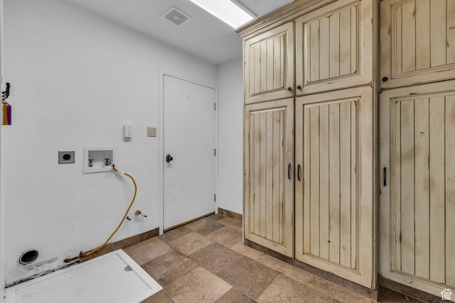 307 E 680 N, Lindon, UT 84042 - clothes washing area with visible vents, washer hookup, stone tile flooring, gas dryer hookup, and cabinet space