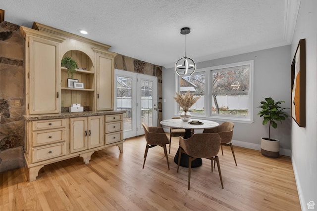 307 E 680 N, Lindon, UT 84042 - dining area with a textured ceiling, ornamental molding, light wood finished floors, baseboards, and a notable chandelier