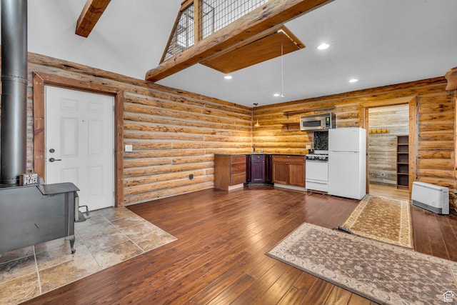 307 E 680 N, Lindon, UT 84042 - kitchen featuring a wood stove, dark wood finished floors, white appliances, recessed lighting, and a high ceiling