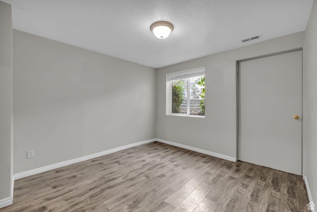 307 E 680 N, Lindon, UT 84042 - unfurnished bedroom featuring visible vents, baseboards, and wood finished floors