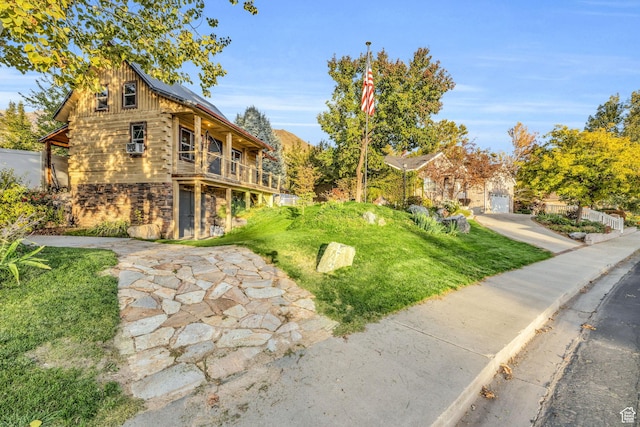 307 E 680 N, Lindon, UT 84042 - exterior space featuring roof mounted solar panels, a garage, a front yard, stone siding, and concrete driveway