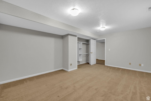307 E 680 N, Lindon, UT 84042 - unfurnished bedroom featuring a closet, baseboards, light colored carpet, and a textured ceiling