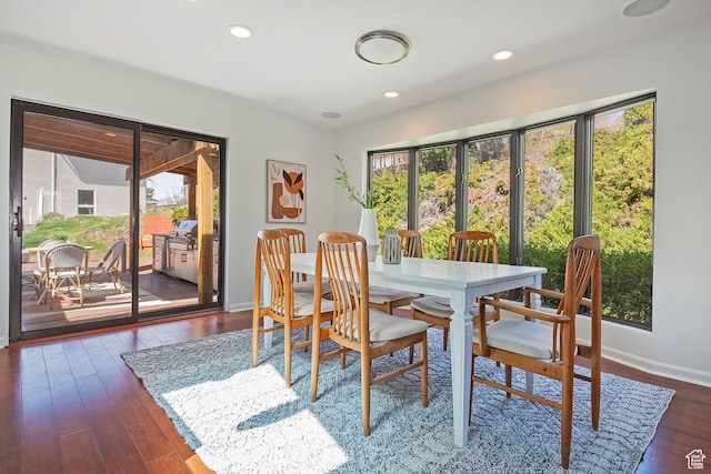 579 E 13th Ave, Salt Lake City, UT 84103 - dining area with dark wood-style flooring, baseboards, and a healthy amount of sunlight