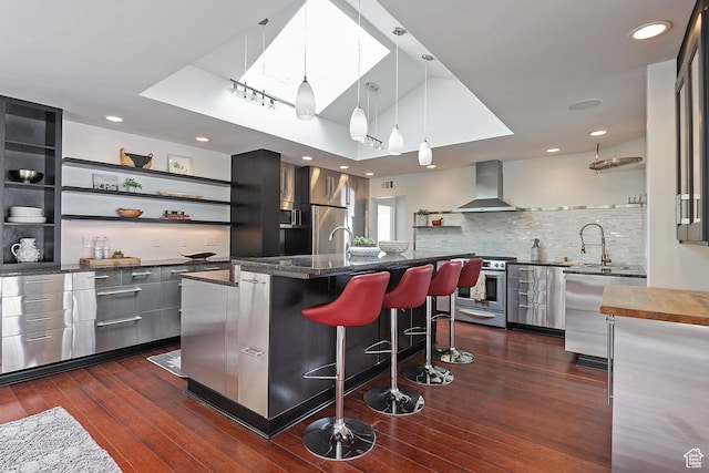 579 E 13th Ave, Salt Lake City, UT 84103 - kitchen featuring wall chimney range hood, open shelves, modern cabinets, dark wood finished floors, and appliances with stainless steel finishes