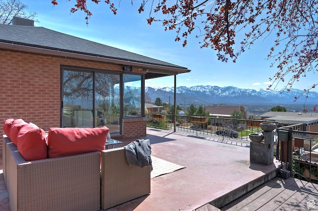 view of patio featuring a mountain view and an outdoor hangout area