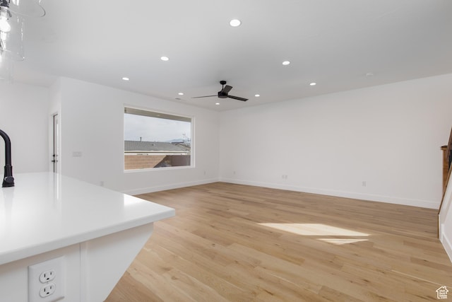 4153 El Capitan Way, St George, UT 84790 - unfurnished living room featuring light wood-style flooring, recessed lighting, baseboards, and a ceiling fan