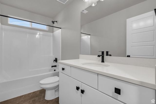 full bath with visible vents, toilet, vanity, and  shower combination